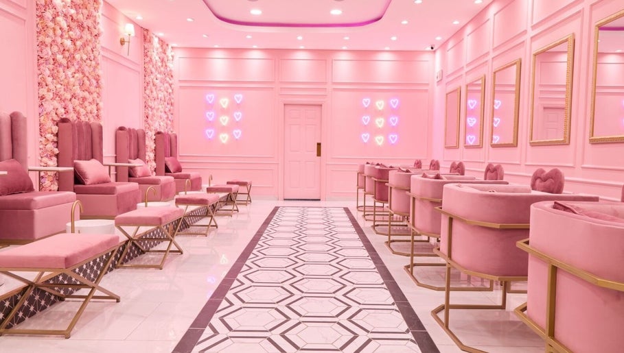 Lavish pink interior of BOA Beauty Bar Mushroom Farm in Midrand, Gauteng, ZA with plush seating and neon accents.
