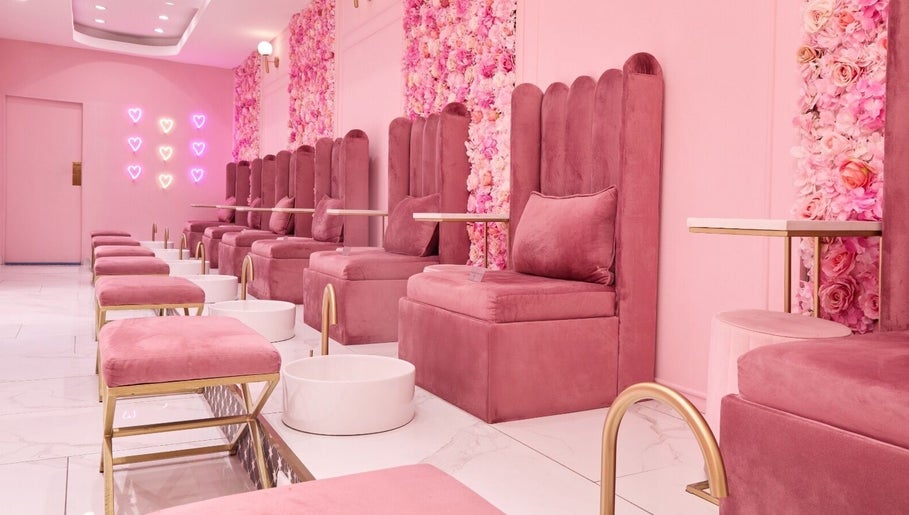 Chic pink seating area at BOA Beauty Bar Verdi Shopping Centre, Randburg, Gauteng, ZA with floral decor.