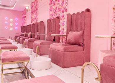 Chic pink seating area at BOA Beauty Bar Verdi Shopping Centre, Randburg, Gauteng, ZA with floral decor.