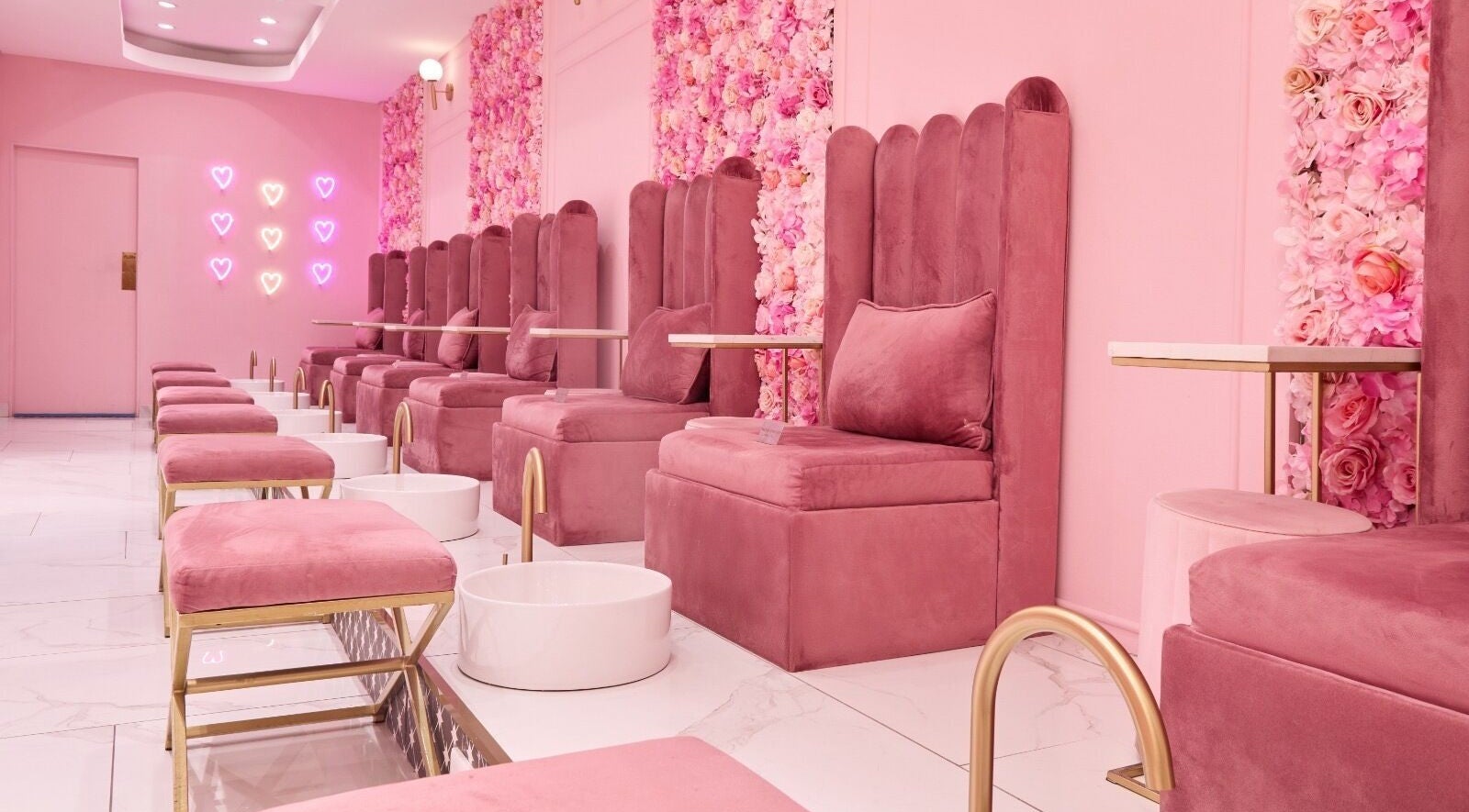 Chic pink seating area at BOA Beauty Bar Verdi Shopping Centre, Randburg, Gauteng, ZA with floral decor.