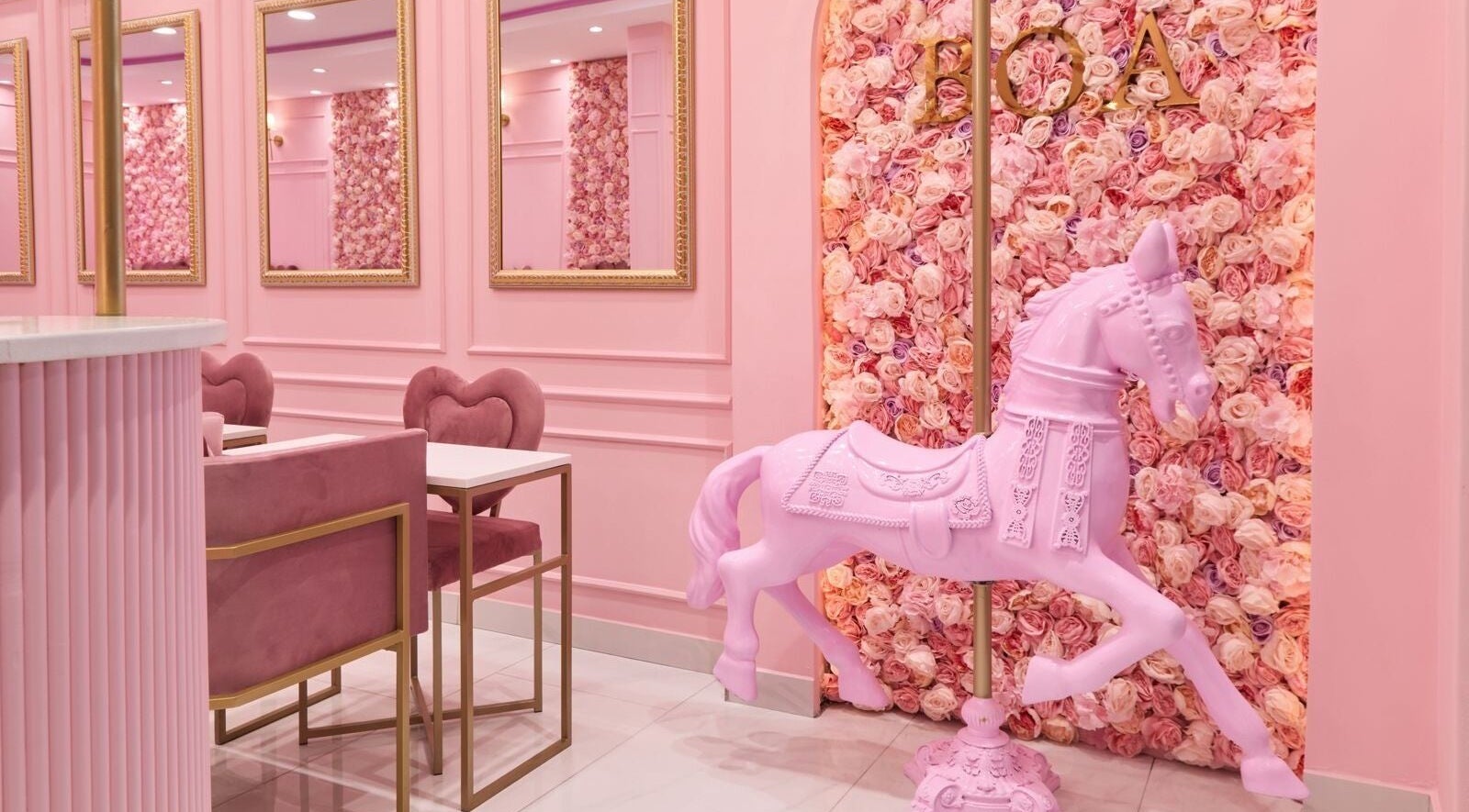 Elegant pink interior at BOA Beauty Bar Mushroom Farm, Midrand, Gauteng, ZA, featuring plush seating and floral decor.