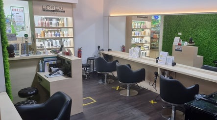 Modern interior of Emerald Hair Studio (Seletar) in Singapore, Singapore, SG with sleek styling chairs.
