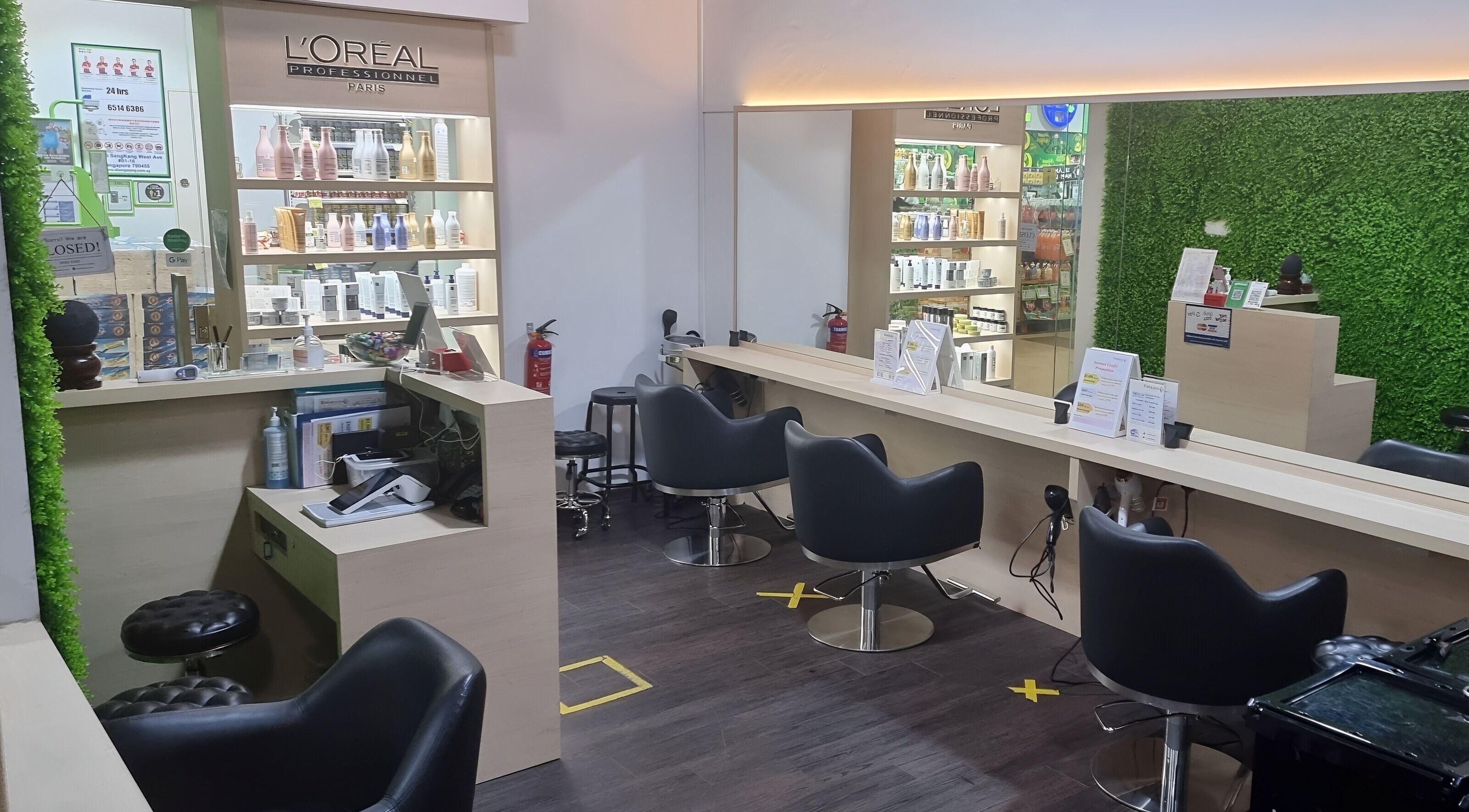 Modern interior of Emerald Hair Studio (Seletar) in Singapore, Singapore, SG with sleek styling chairs.