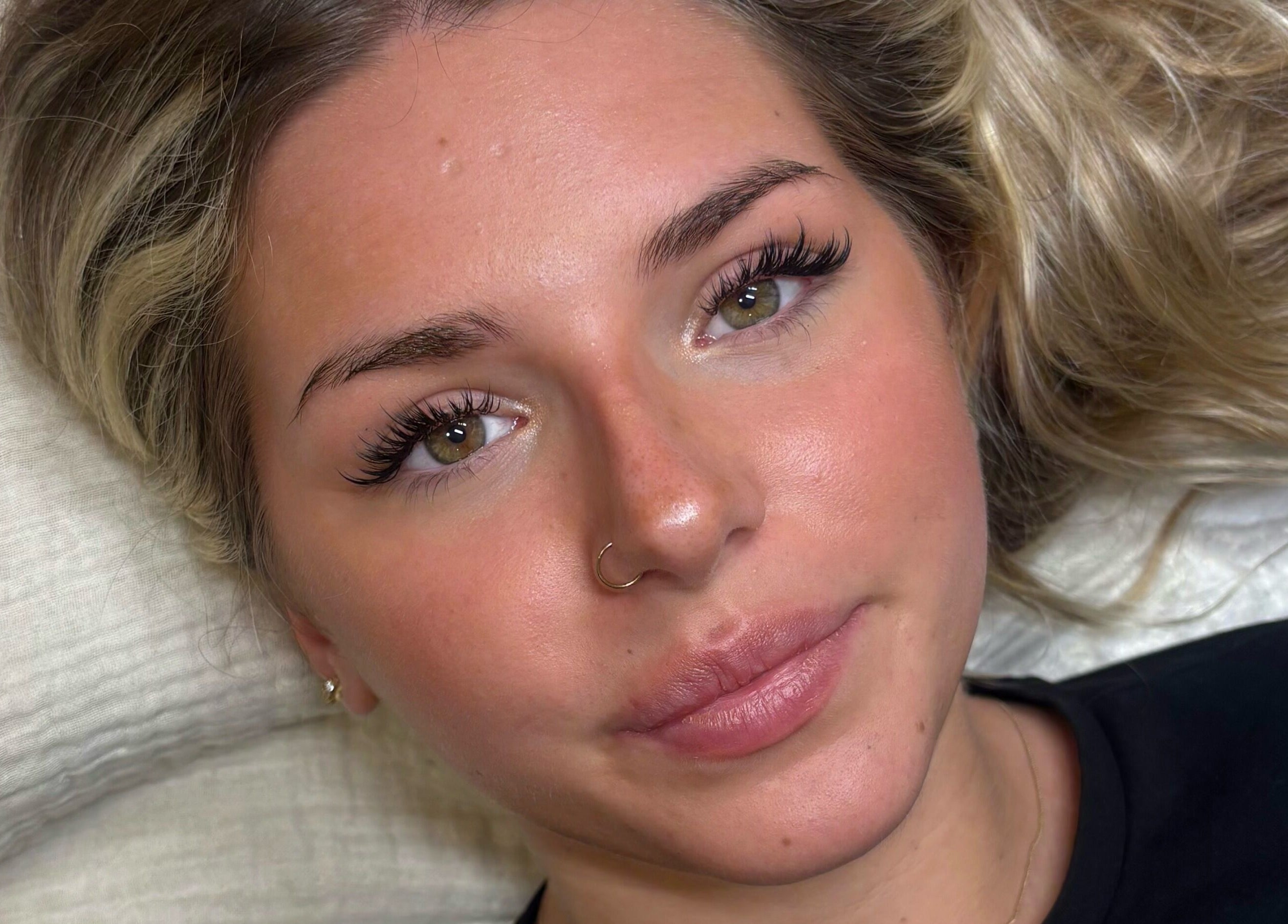Close-up of a woman with enhanced eyelashes at H L Beauty, Leeds, England, GB.