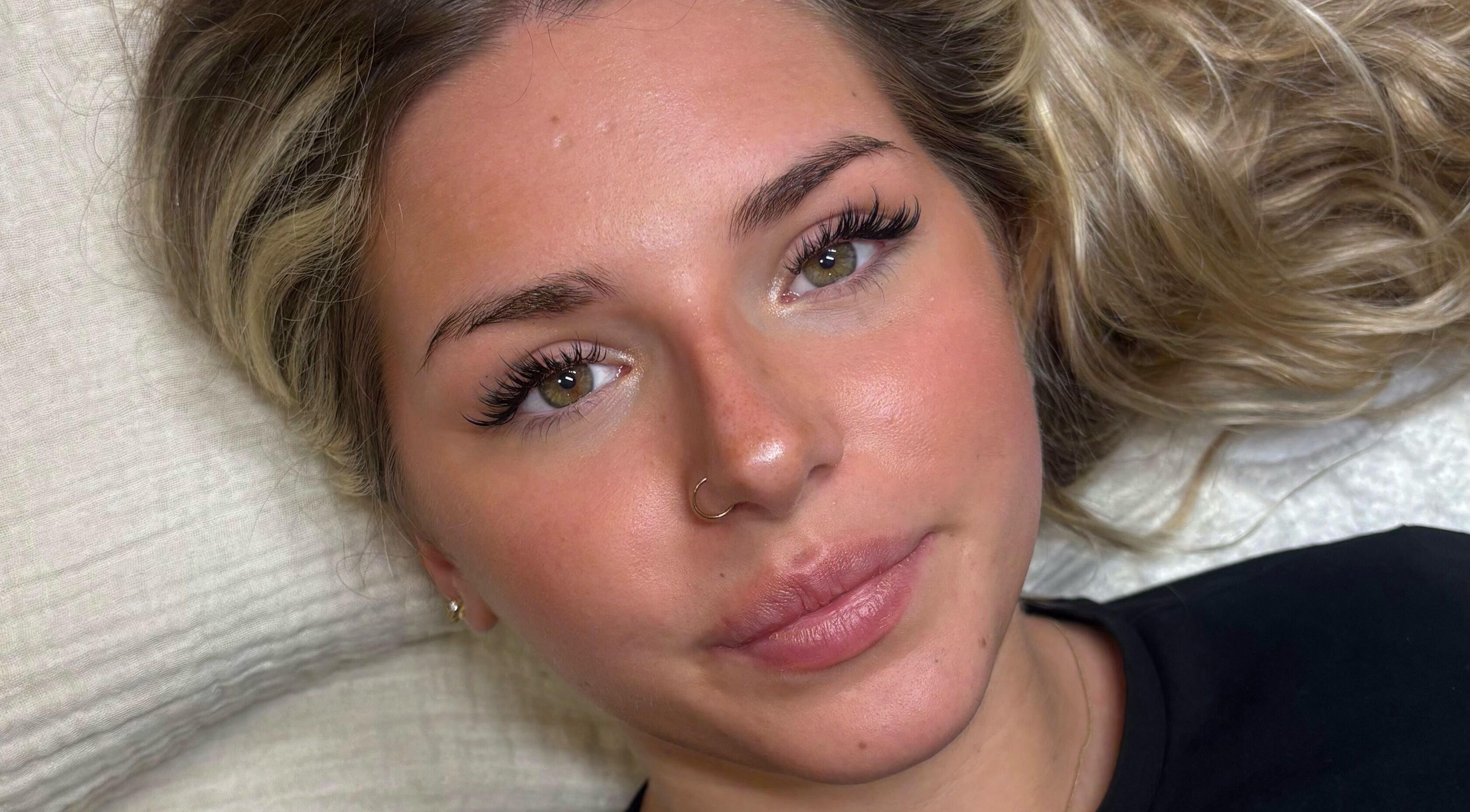 Close-up of a woman with enhanced eyelashes at H L Beauty, Leeds, England, GB.