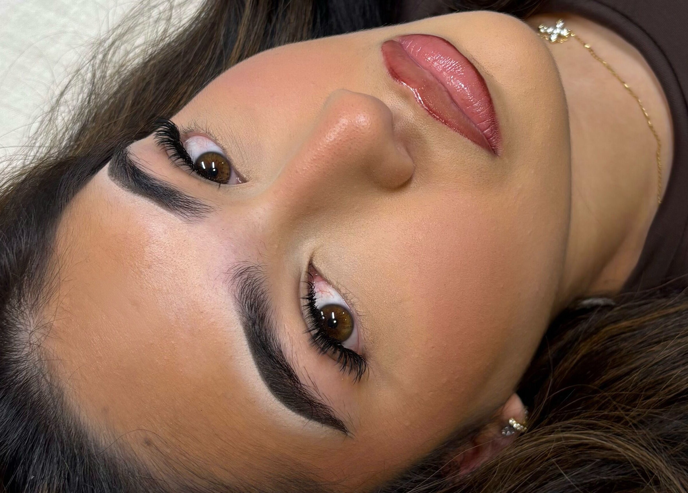 Close-up of a woman's face with expertly shaped eyebrows at H L Beauty, Leeds, England, GB.