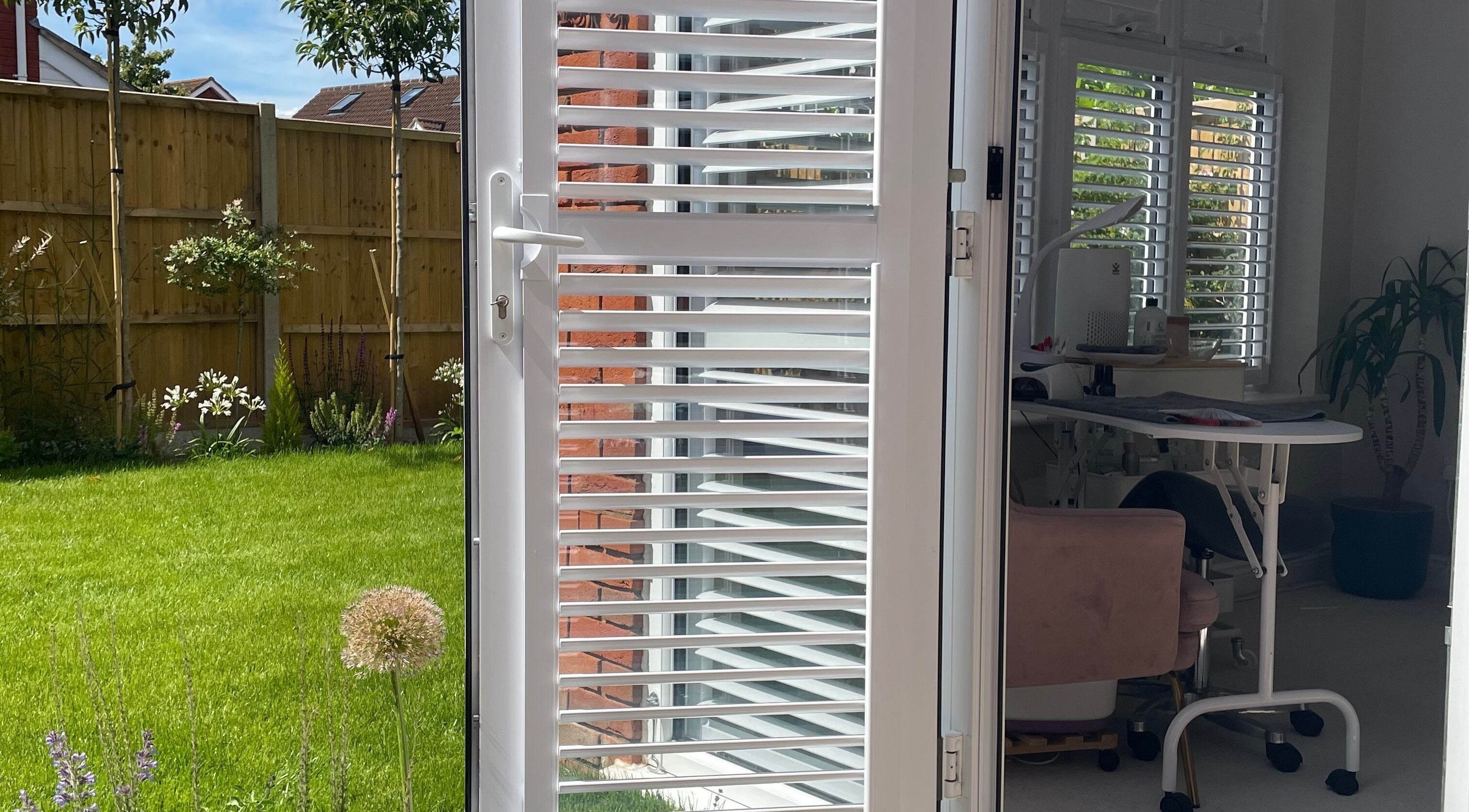 Inviting garden view at Bramley Beauty, Bramley, England, GB with lush greenery and bright sunlight.