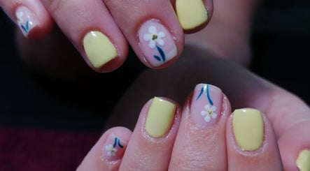 Chic yellow nails with floral art at Majestic Beauty Co, Cape Town, Western Cape, ZA.