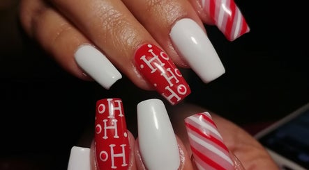 Elegant festive nail art at Majestic Beauty Co, Cape Town, Western Cape, ZA featuring red and white designs.