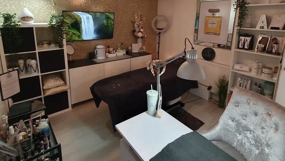 Elegant treatment room at Beauty by Anita in Tyldesley, England, GB featuring a cozy bed and decor.