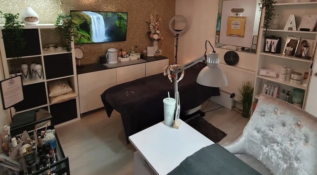 Elegant treatment room at Beauty by Anita in Tyldesley, England, GB featuring a cozy bed and decor.