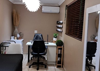 Cozy interior of Sculpture Tech Lash and Nail Artistry in Kingsburgh, Kwazulu-natal, ZA with elegant decor.