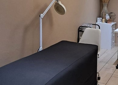 Treatment room at Sculpture Tech Lash and Nail Artistry, Kingsburgh, Kwazulu-natal, ZA, featuring a massage bed.
