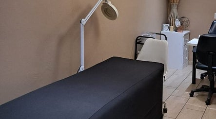 Treatment room at Sculpture Tech Lash and Nail Artistry, Kingsburgh, Kwazulu-natal, ZA, featuring a massage bed.