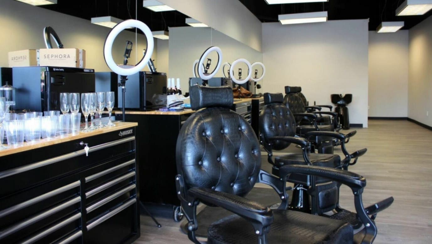 Sleek interior of Royalz Barbers in Oregon City, Oregon, US, featuring leather chairs and modern barbering tools.