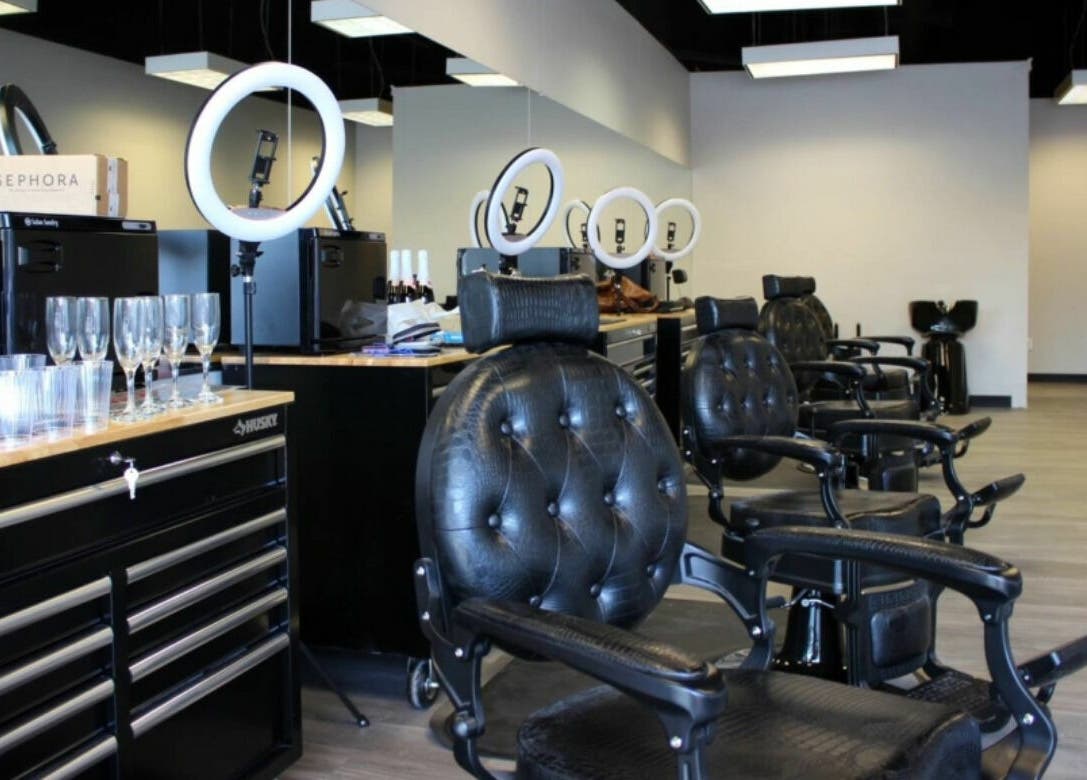 Sleek interior of Royalz Barbers in Oregon City, Oregon, US, featuring leather chairs and modern barbering tools.