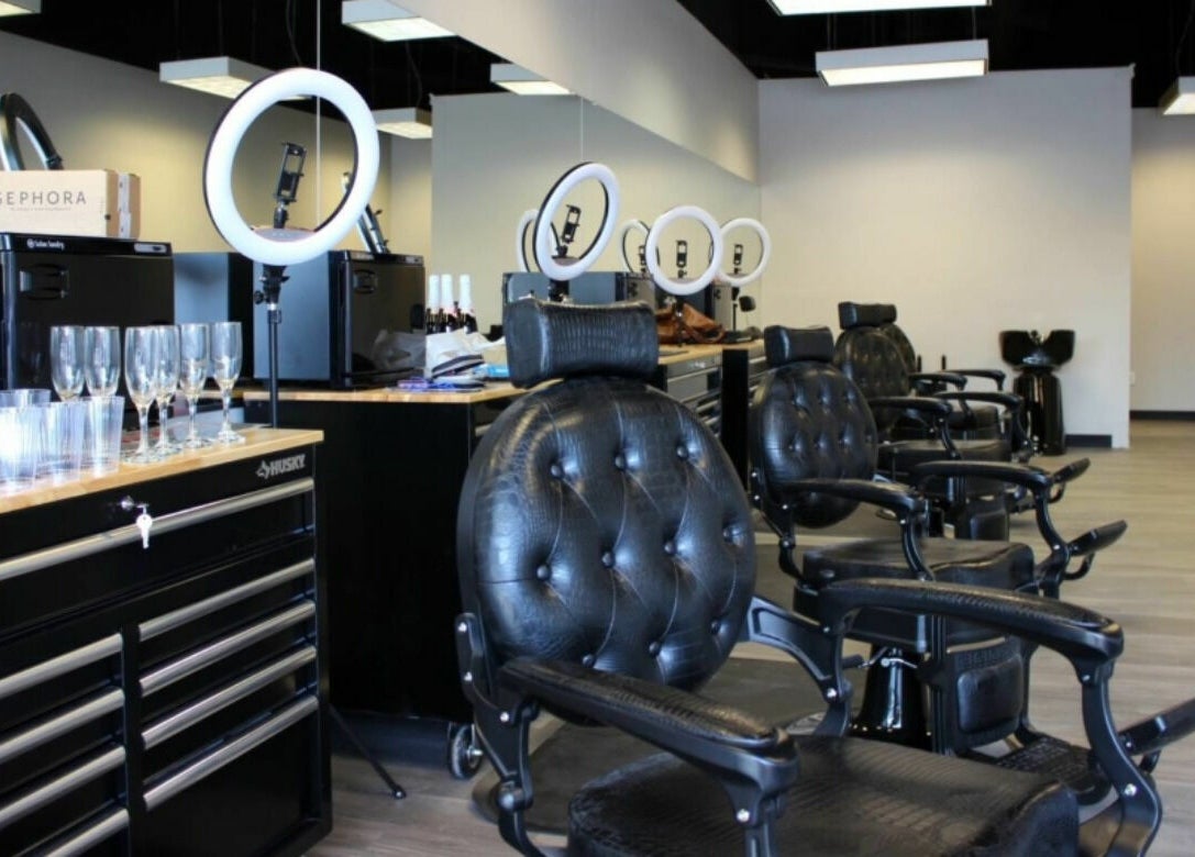 Sleek interior of Royalz Barbers in Oregon City, Oregon, US, featuring leather chairs and modern barbering tools.