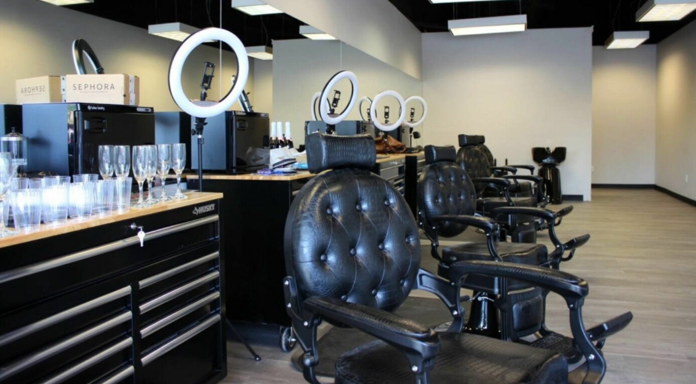 Sleek interior of Royalz Barbers in Oregon City, Oregon, US, featuring leather chairs and modern barbering tools.