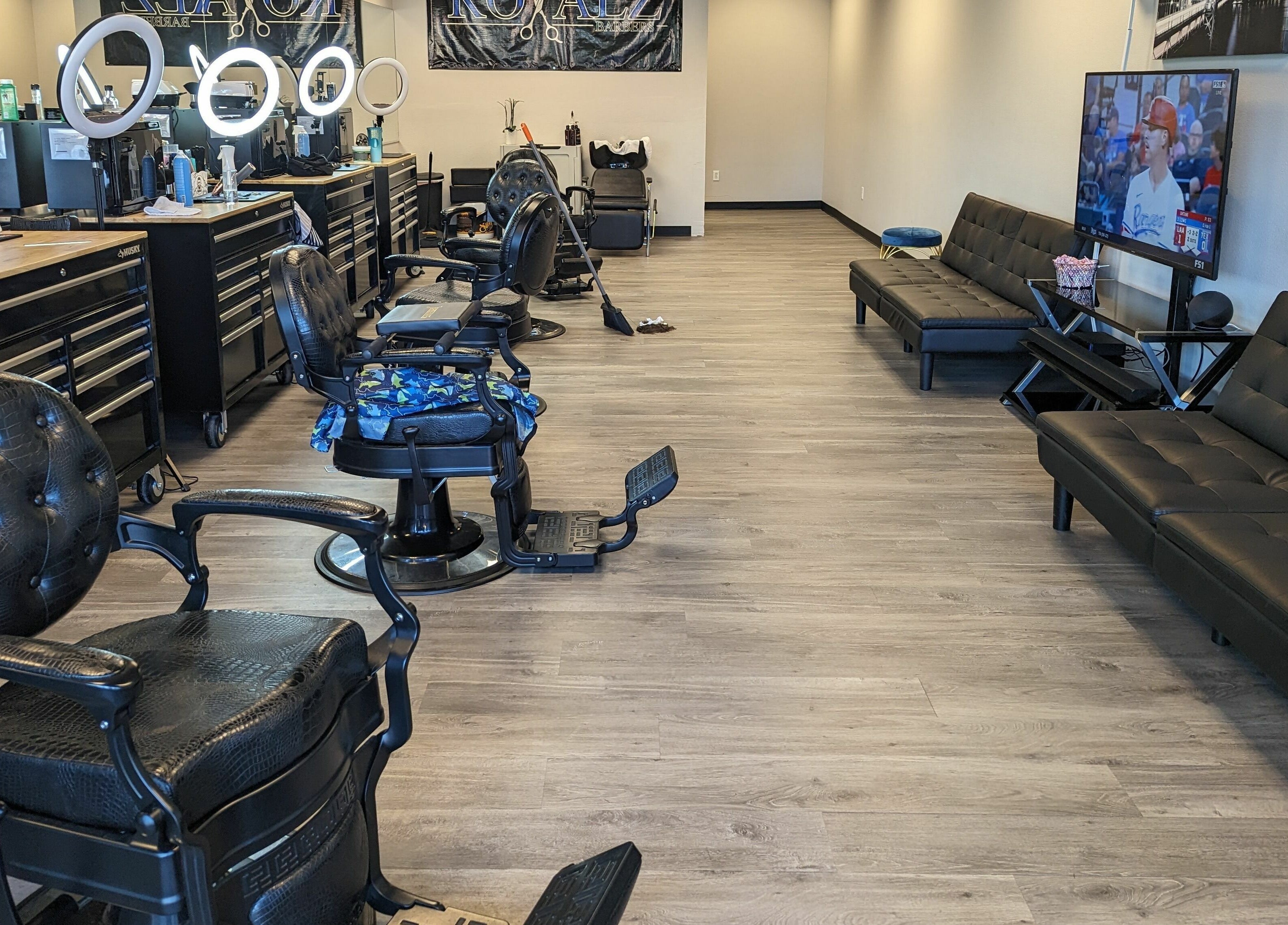 Spacious interior of Royalz Barbers in Oregon City, Oregon, US, featuring modern barber chairs and sleek decor.