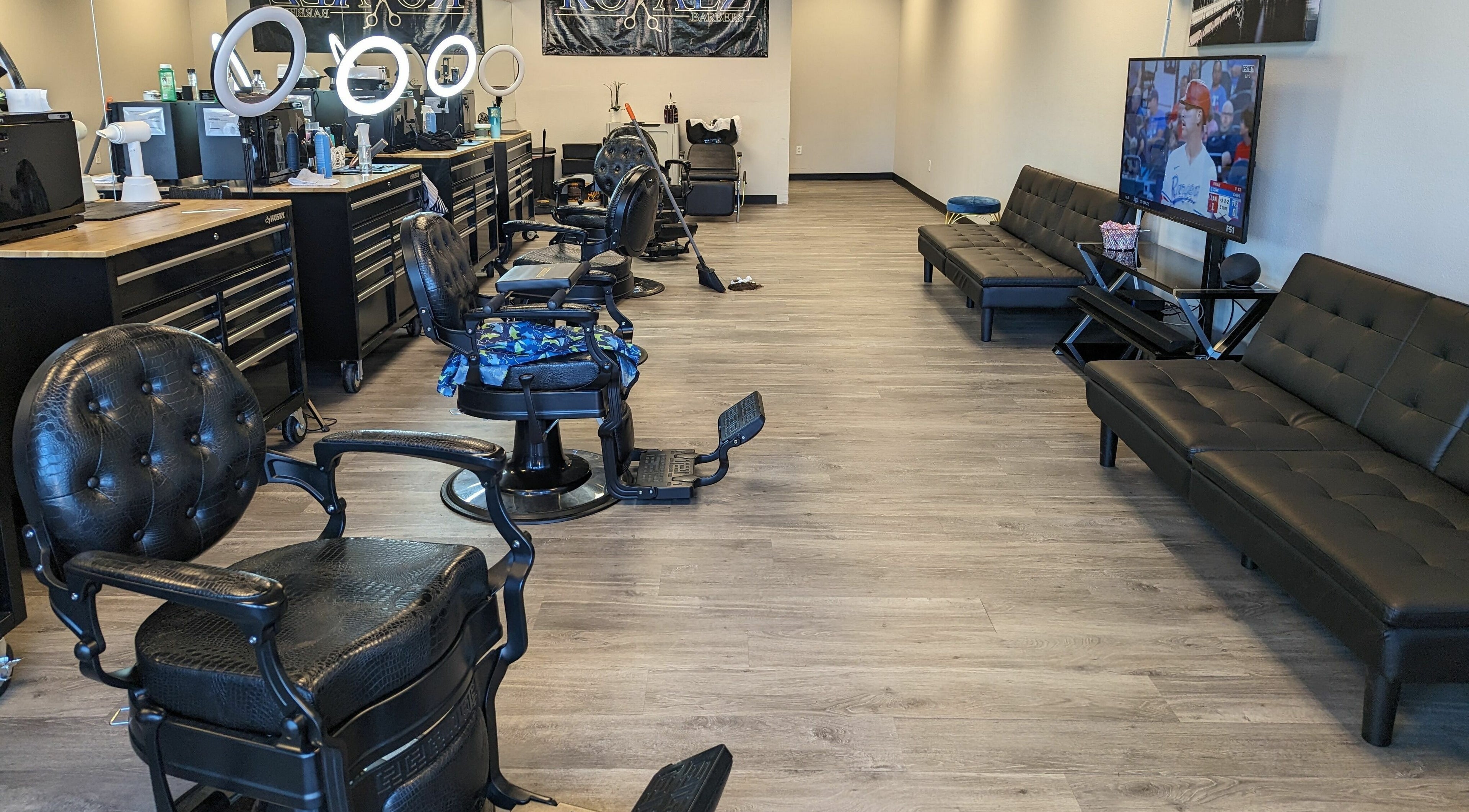 Spacious interior of Royalz Barbers in Oregon City, Oregon, US, featuring modern barber chairs and sleek decor.