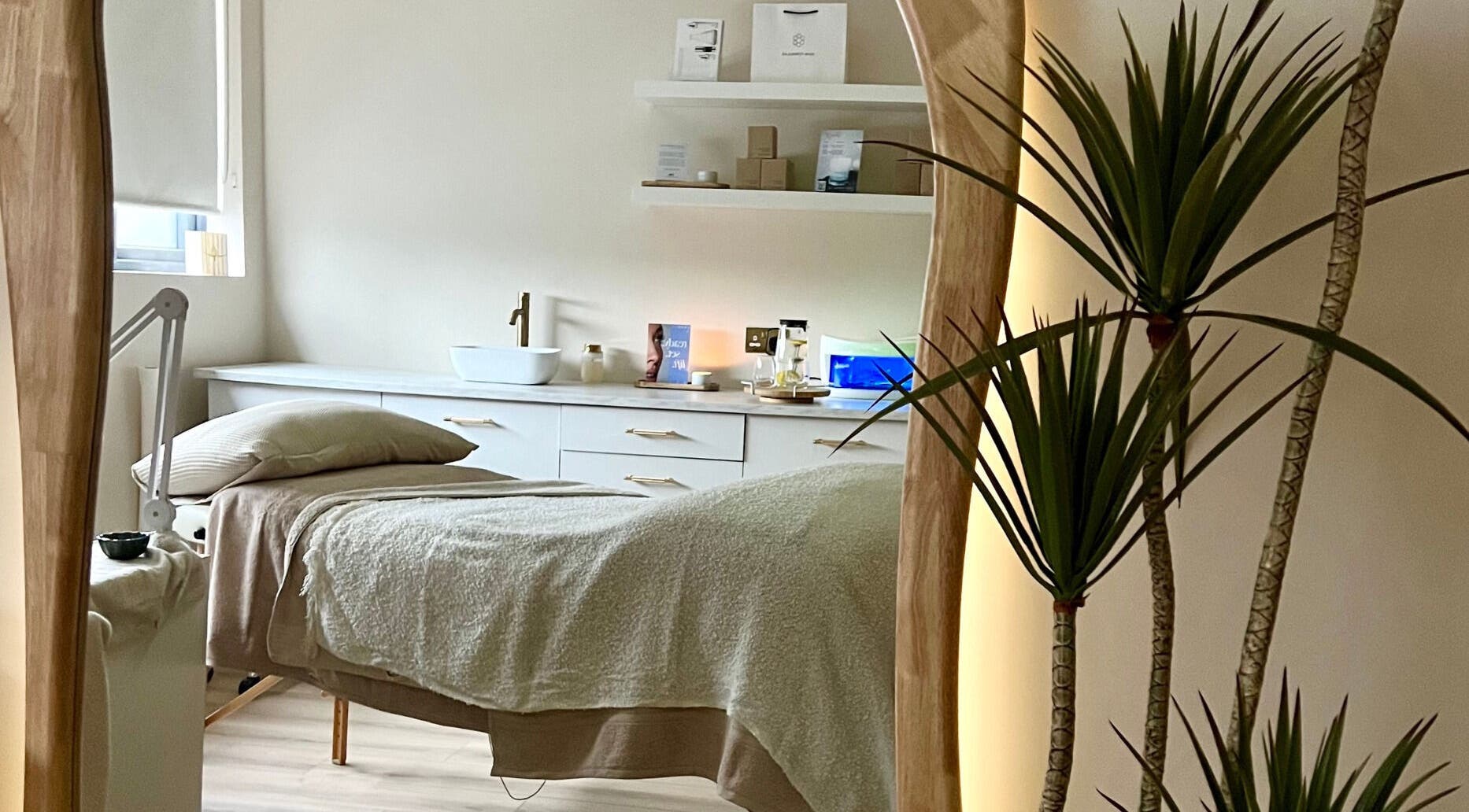 Serene treatment room at Beauty Lab, Drogheda, IE, featuring a massage bed and calming decor.