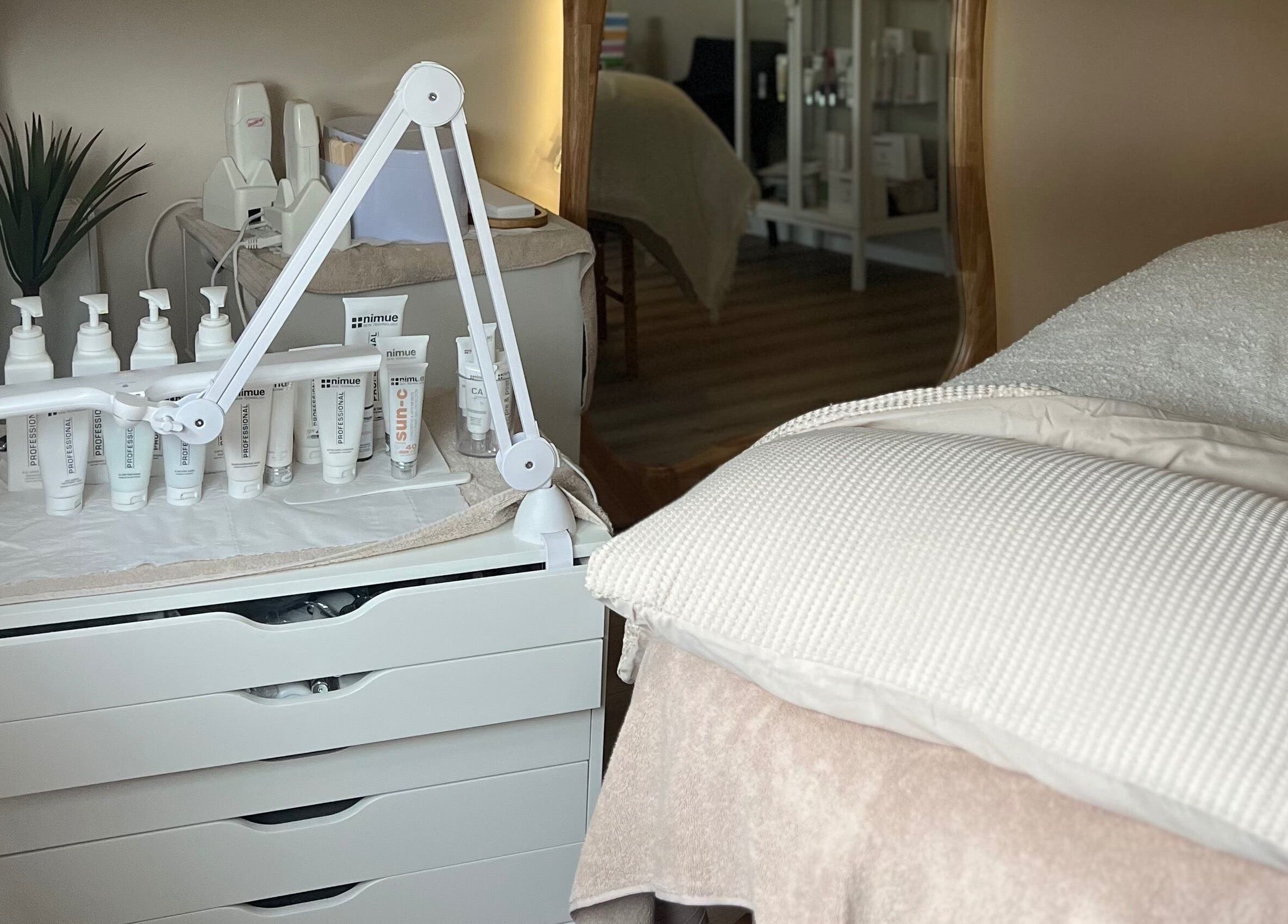 Beauty Lab Drogheda, IE treatment room with skincare products and a comfortable bed setup.