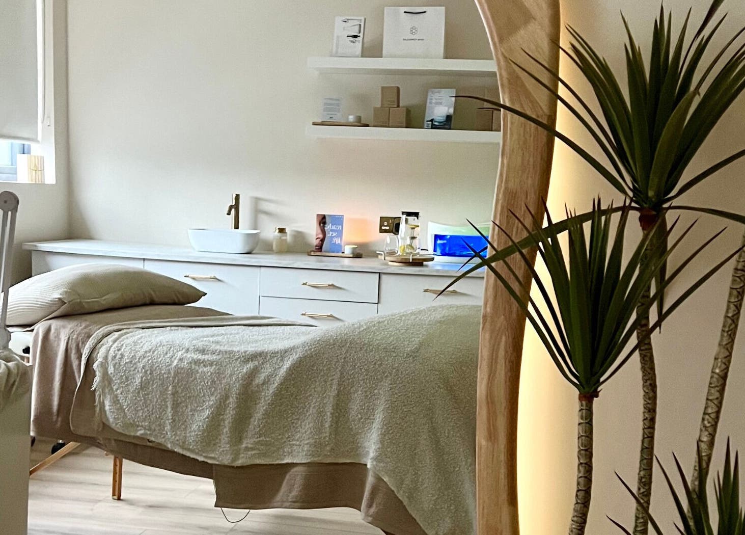 Cozy treatment room at Beauty Lab in Drogheda, IE with soft lighting and elegant decor.