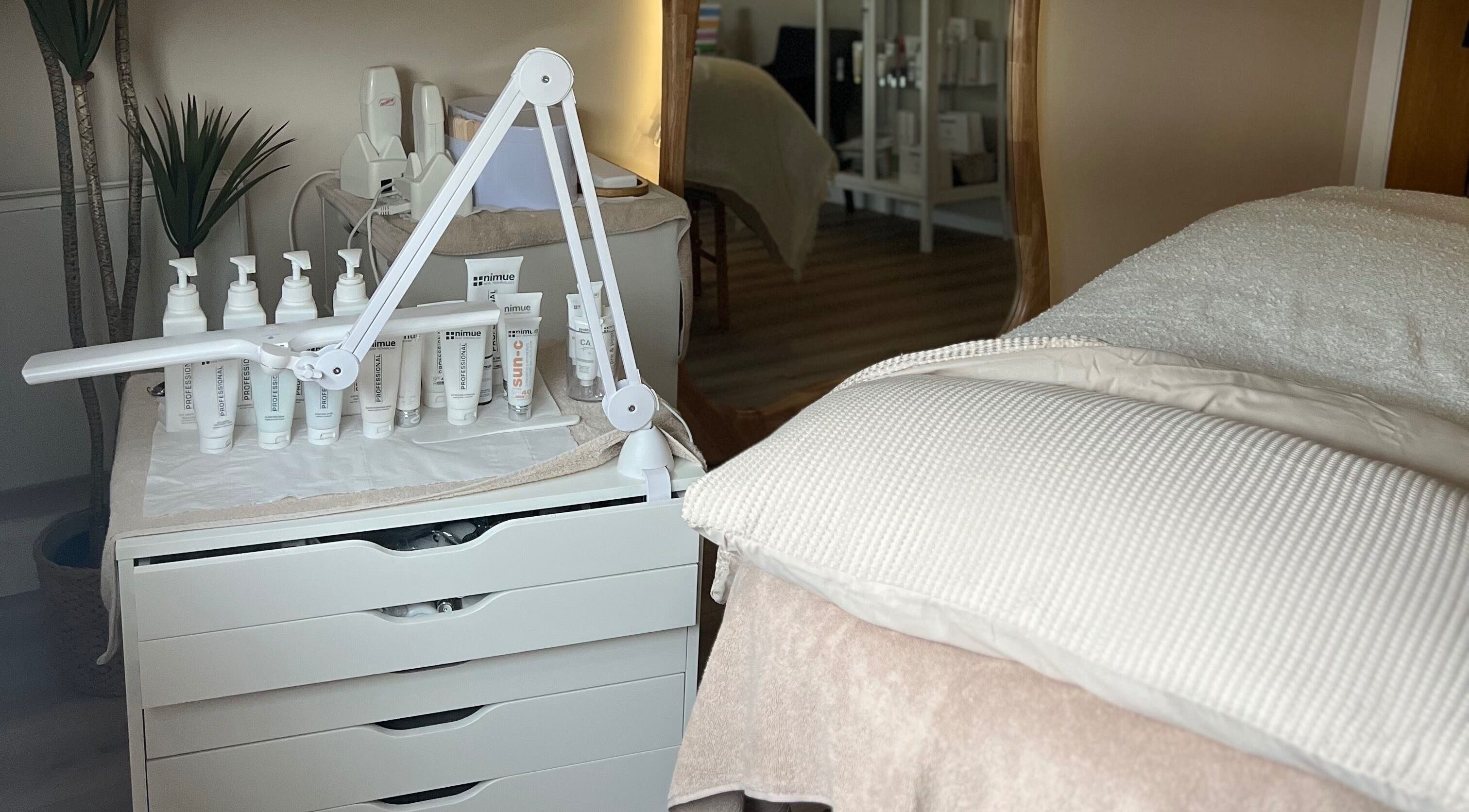 Beauty Lab spa room in Drogheda, IE with skincare products and a treatment bed.