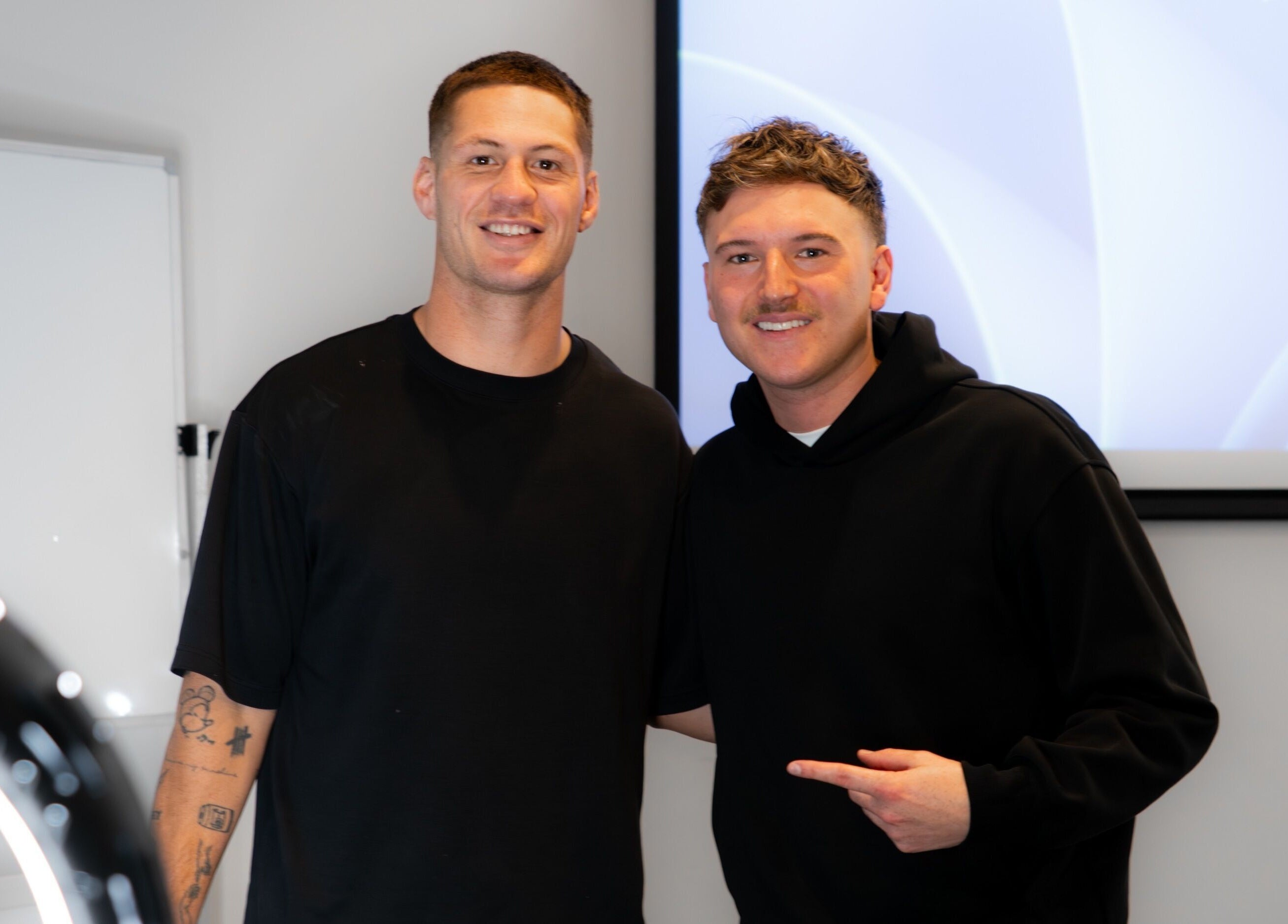Two individuals smiling at FLETCHCUTZ salon in Woodvale, Western Australia, AU.