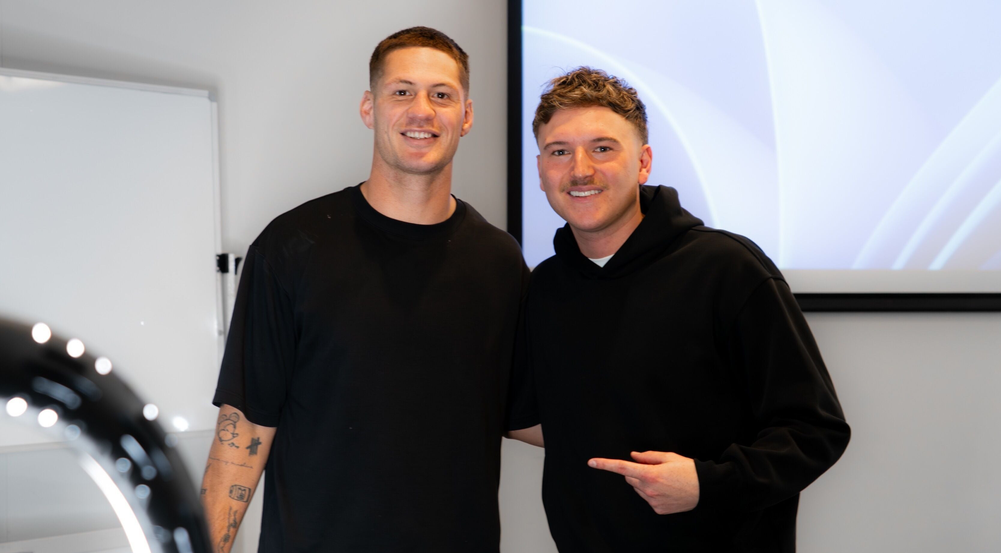 Two individuals smiling at FLETCHCUTZ salon in Woodvale, Western Australia, AU.