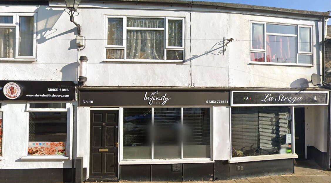Front view of Infinity Hair salon in Littleport, England, GB, showcasing the stylish exterior.
