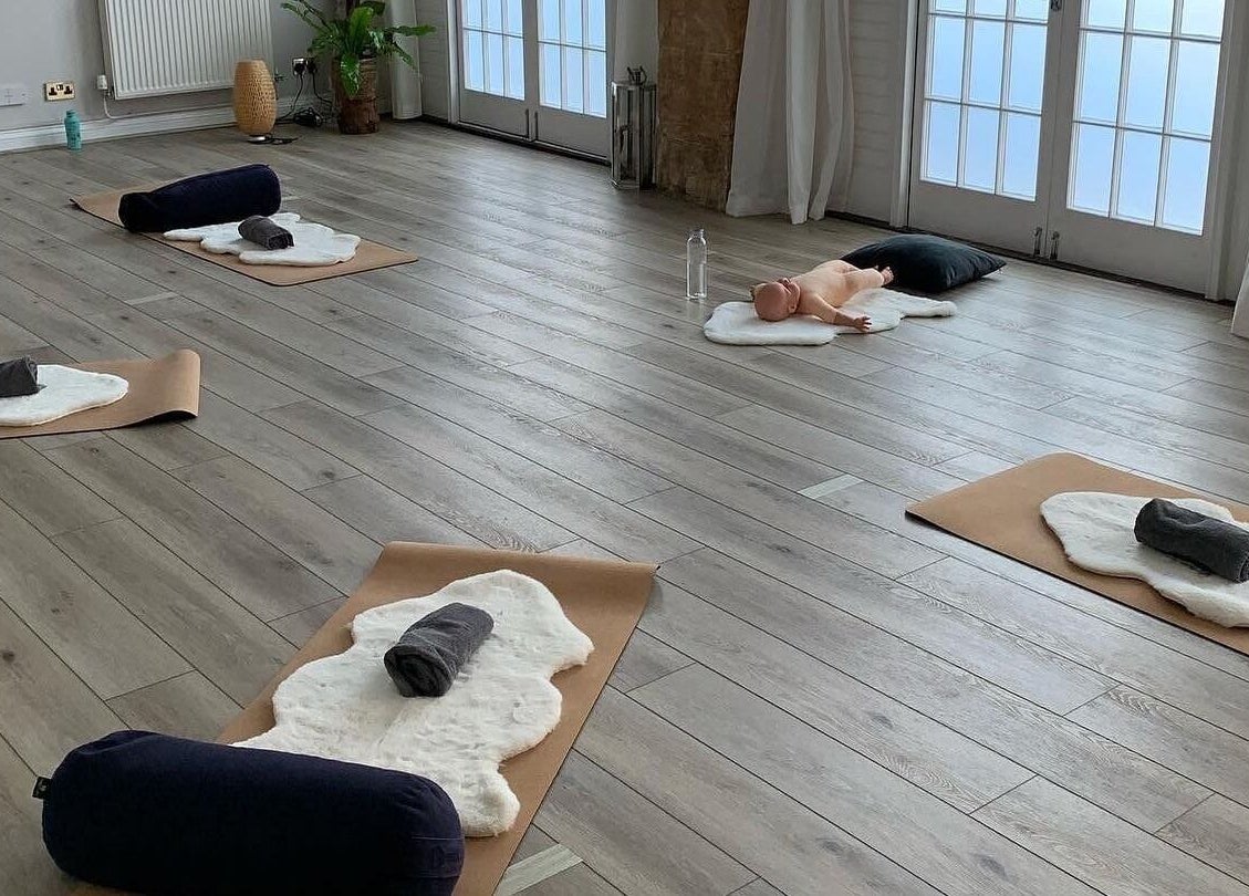 Yoga mats arranged in a peaceful room at Living Well Reflexology, Mickleton, England, GB.