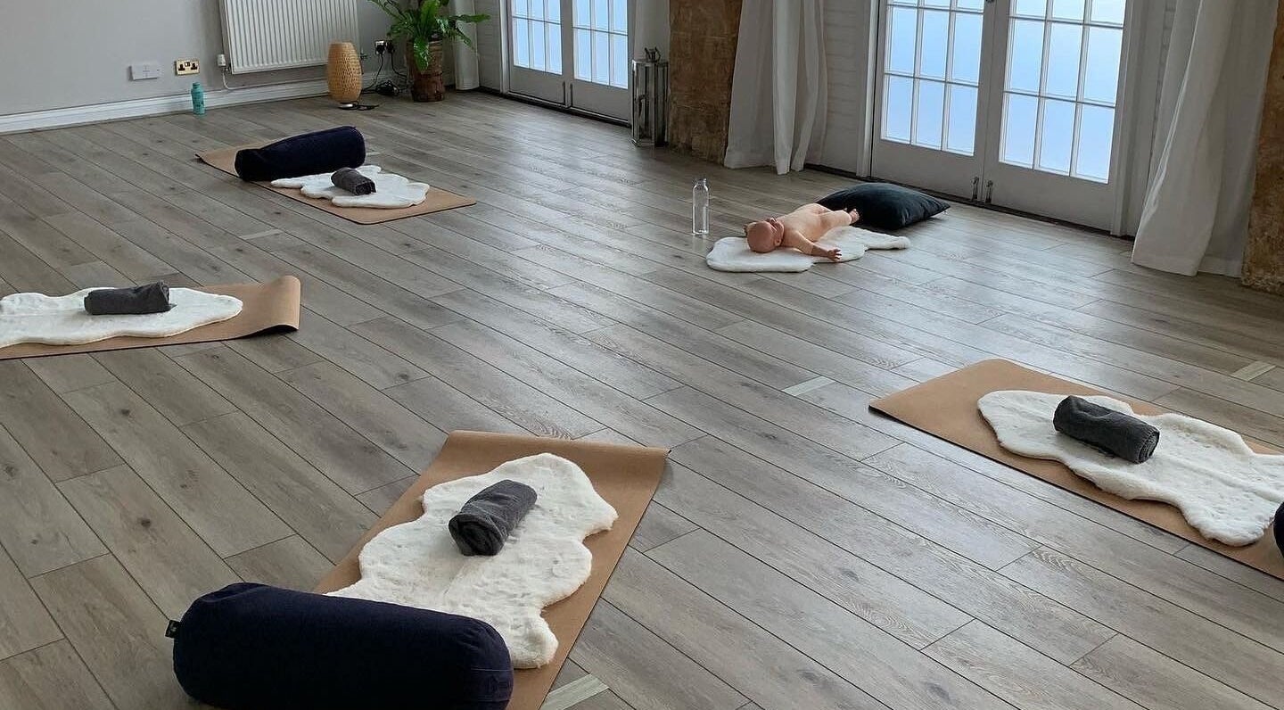 Yoga mats arranged in a peaceful room at Living Well Reflexology, Mickleton, England, GB.