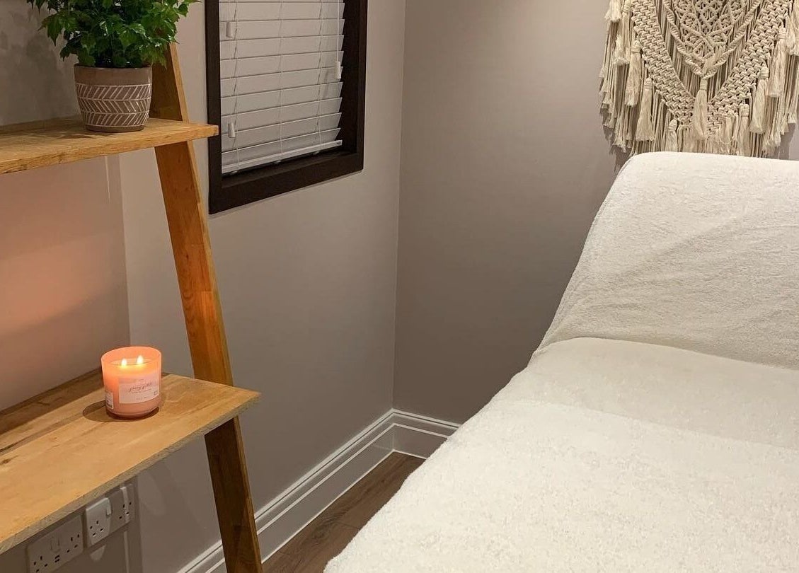 Tranquil therapy room at Living Well Reflexology in Mickleton, England, GB, featuring a massage bed and soothing decor.