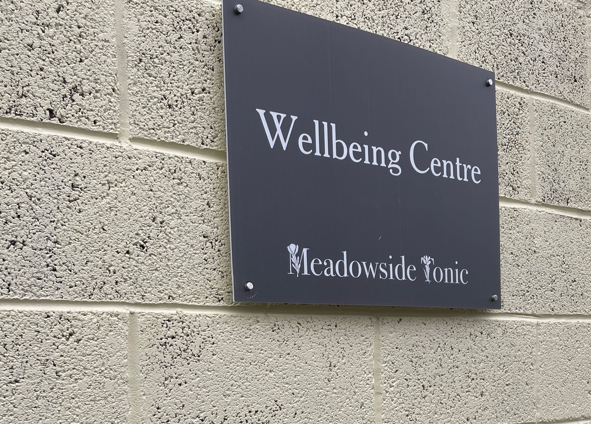 Exterior sign of Wellbeing Centre at Living Well Reflexology, Mickleton, England, GB.