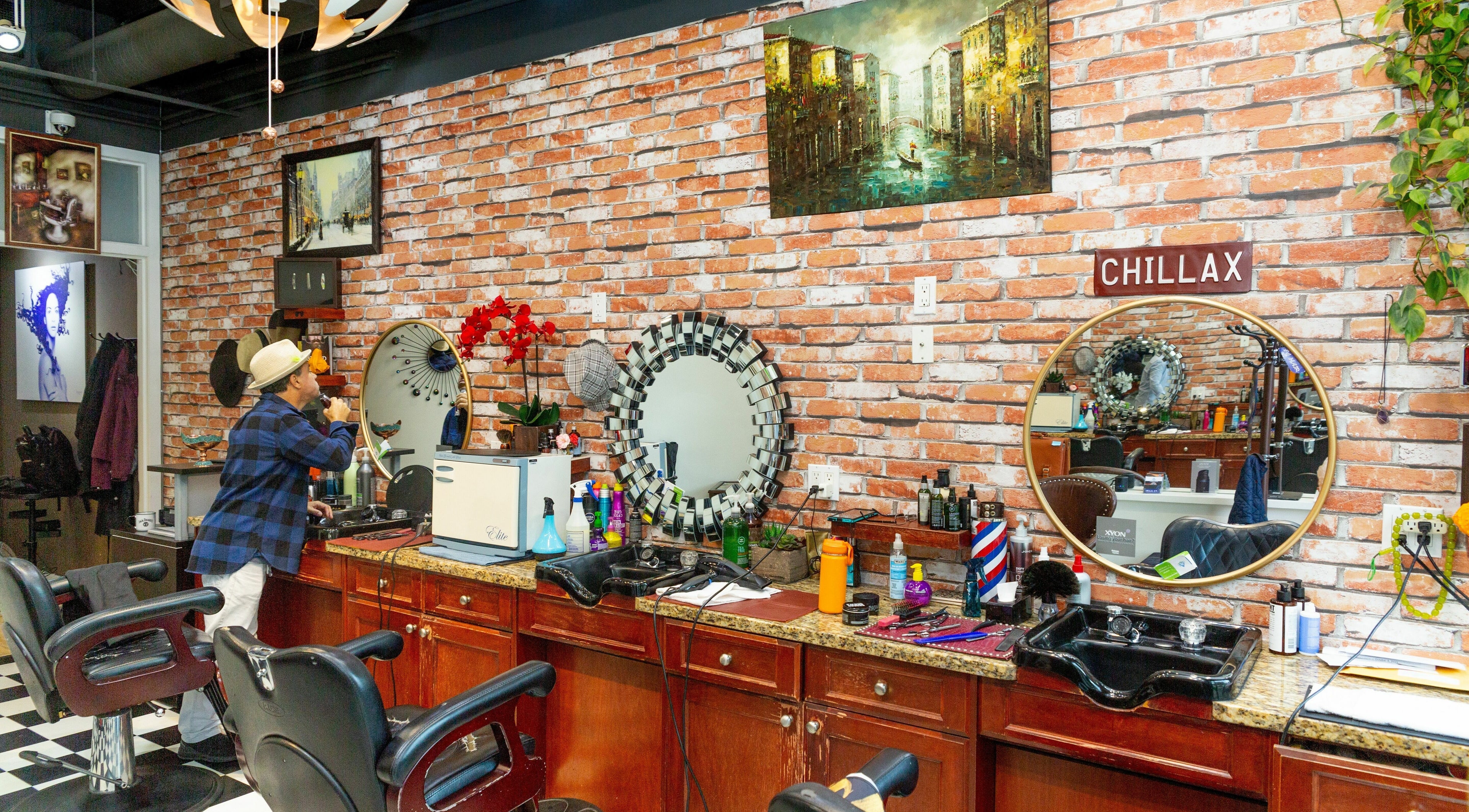 Interior of Modern Man Barbershop in Vancouver, British Columbia, CA showcasing styling chairs, mirrors, and decor.
