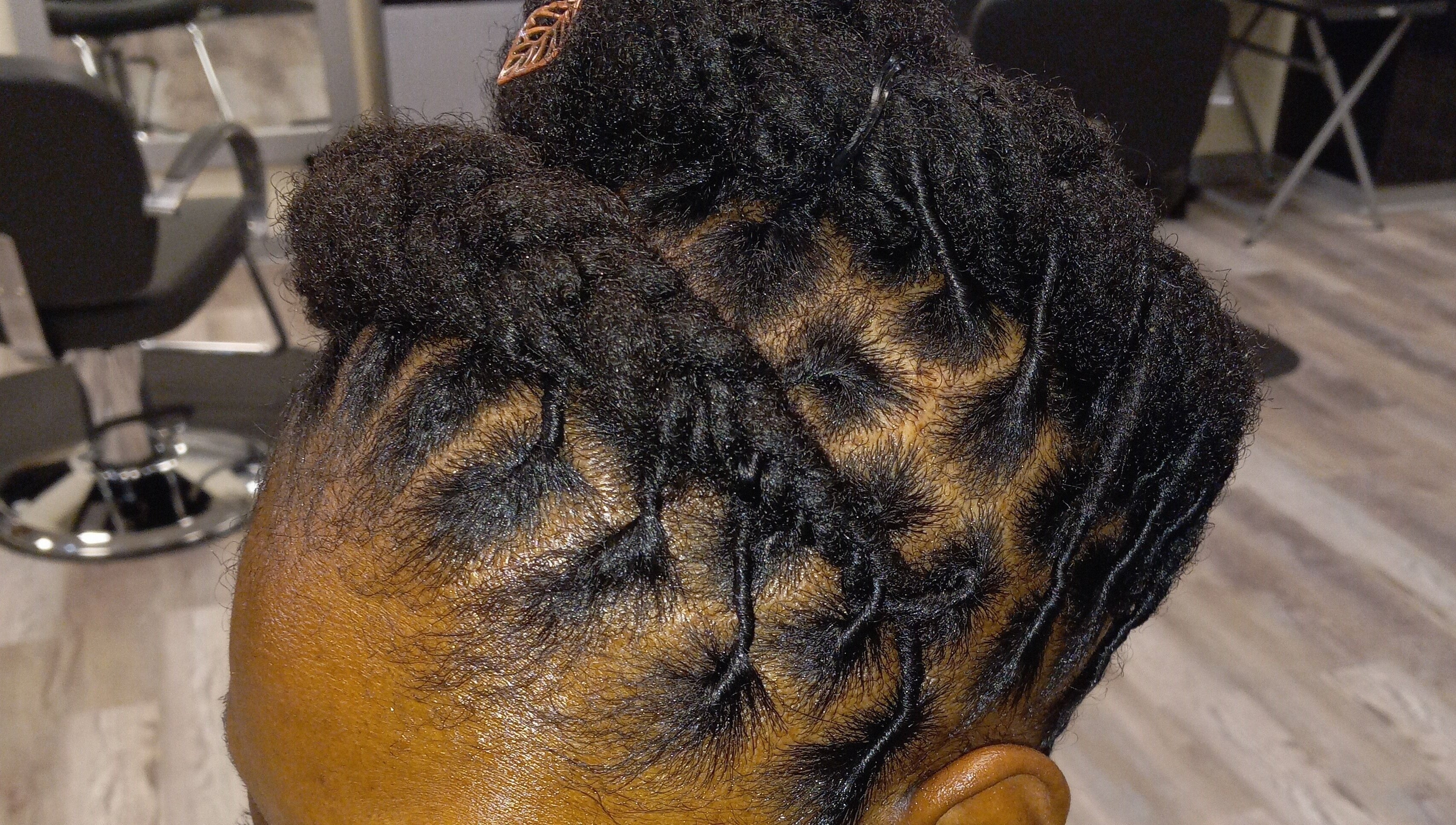 Intricate braided hairstyle at LaMoore Naturals, East McKeesport, Pennsylvania, US.