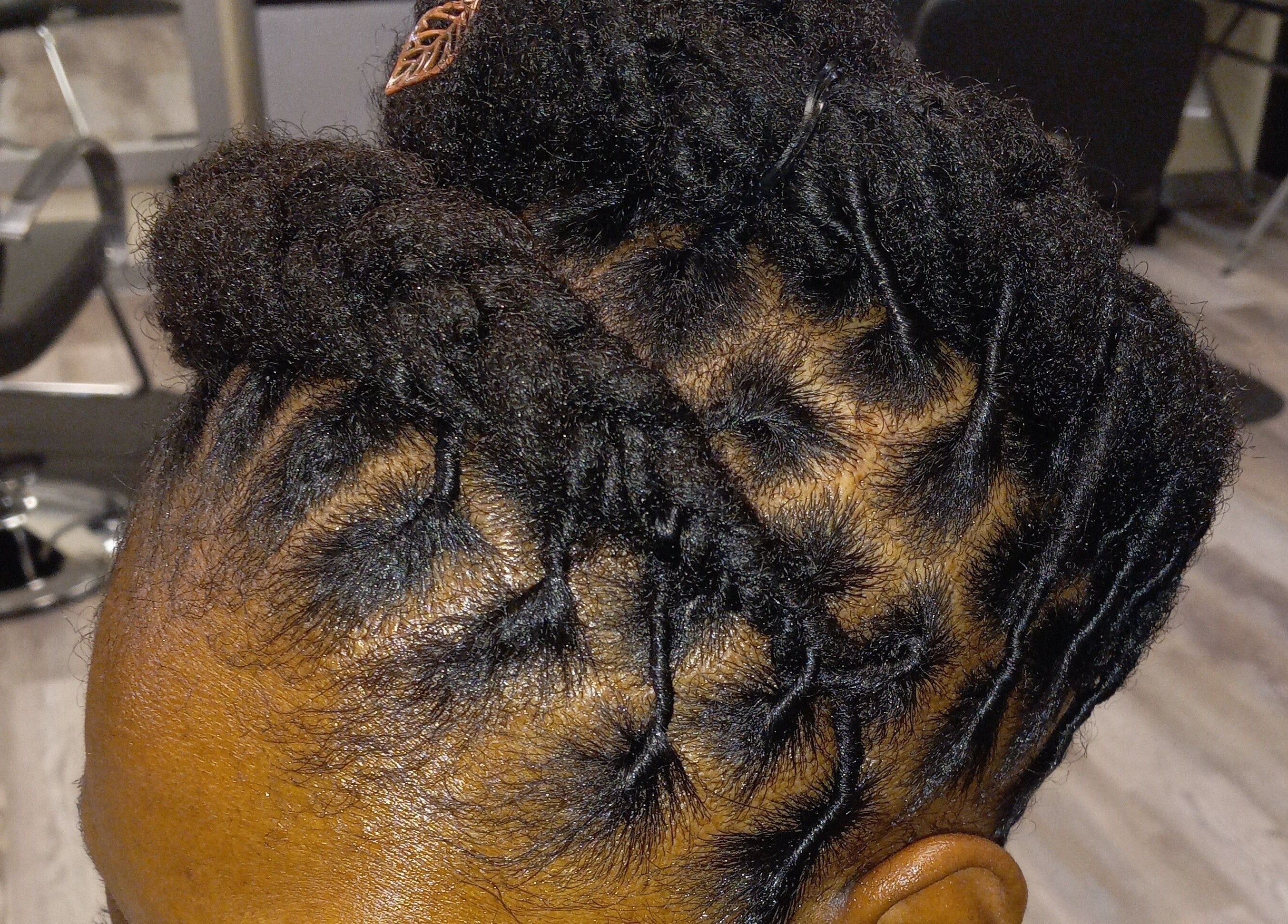 Intricate braided hairstyle at LaMoore Naturals, East McKeesport, Pennsylvania, US.