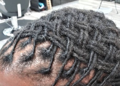 Intricate braids styling at LaMoore Naturals, East McKeesport, Pennsylvania, US.