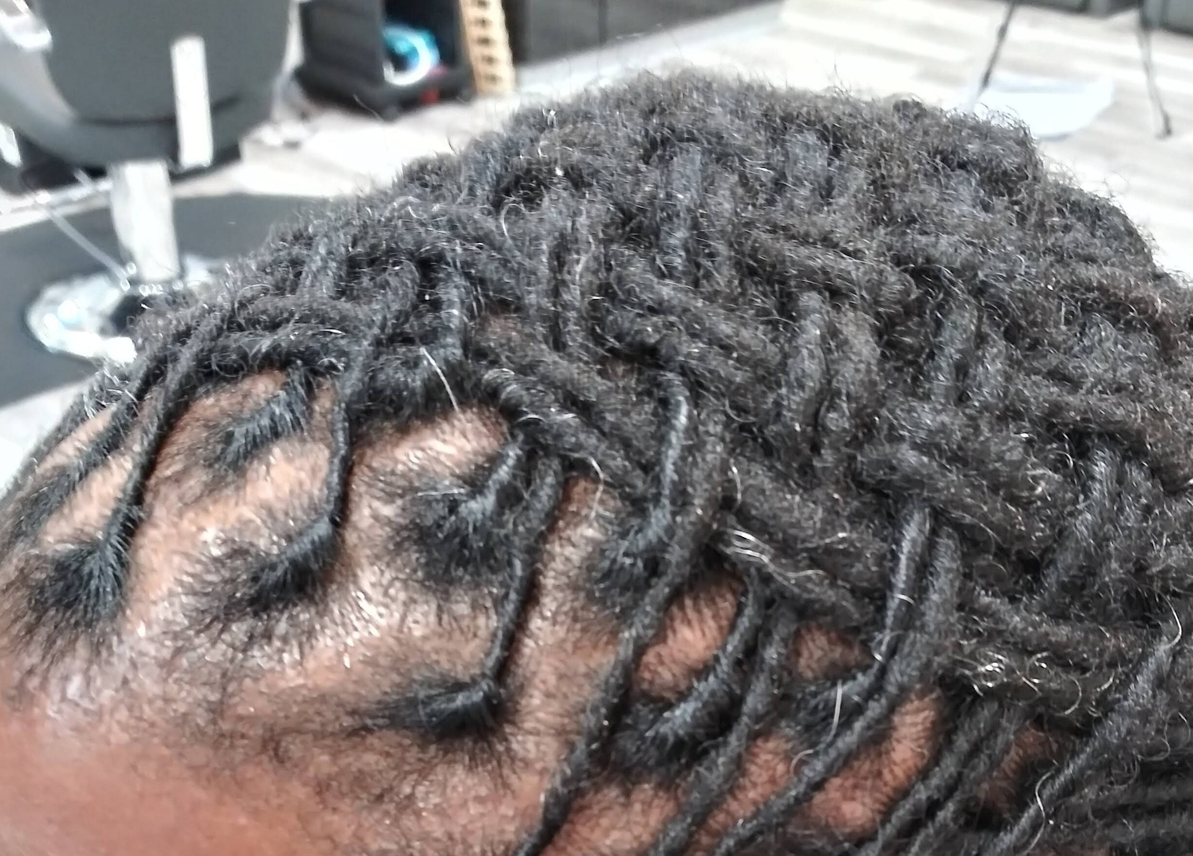 Intricate braids styling at LaMoore Naturals, East McKeesport, Pennsylvania, US.