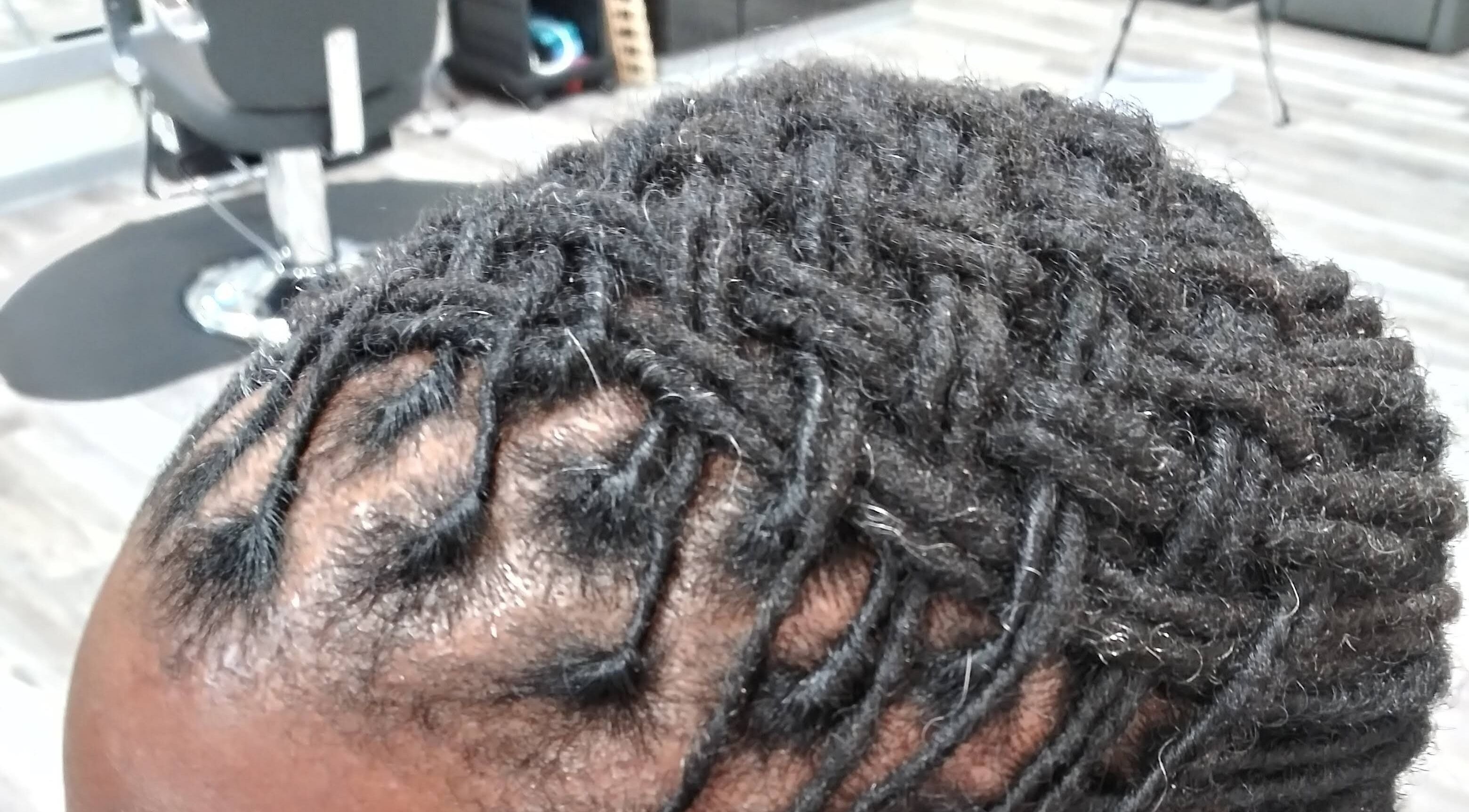 Intricate braids styling at LaMoore Naturals, East McKeesport, Pennsylvania, US.