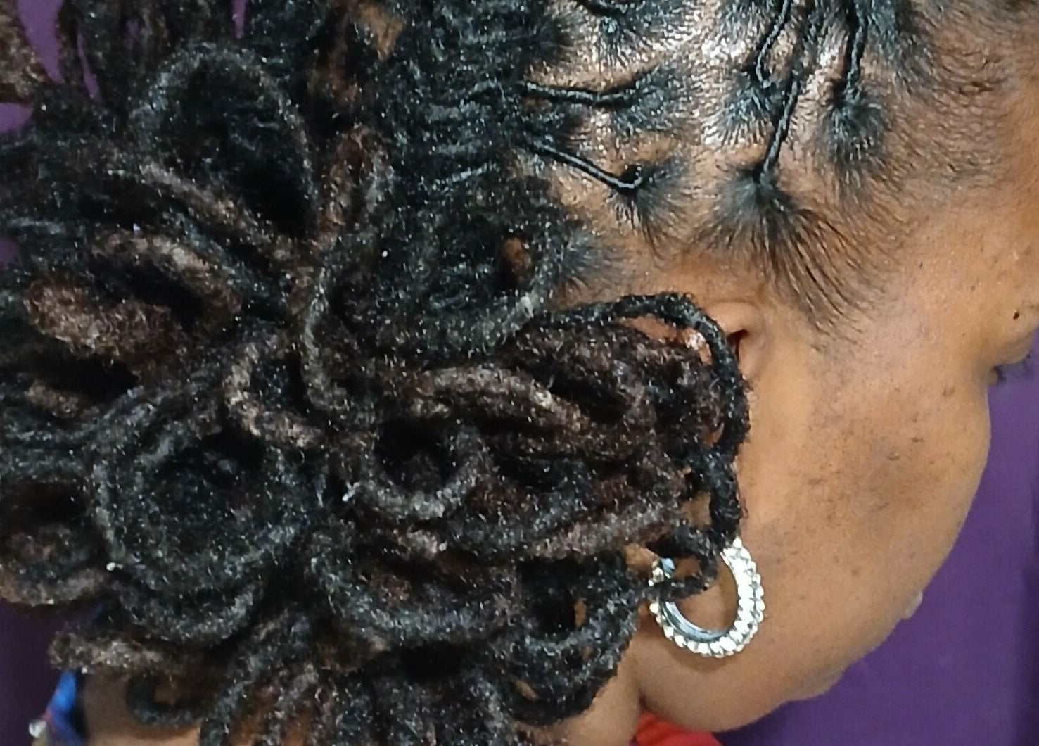Beautifully styled locs at LaMoore Naturals in East McKeesport, Pennsylvania, US, showcasing intricate hair design.