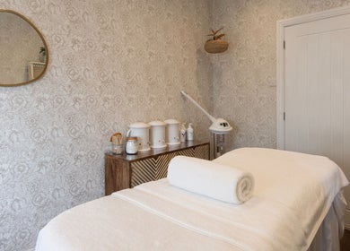 Relaxing therapy room at Cocoon Bristol, Bristol, England, GB with ambient lighting and calming decor.