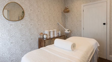 Relaxing therapy room at Cocoon Bristol, Bristol, England, GB with ambient lighting and calming decor.