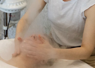Facial treatment with steamer at Cocoon Bristol, located in Bristol, England, GB, enhancing relaxation.