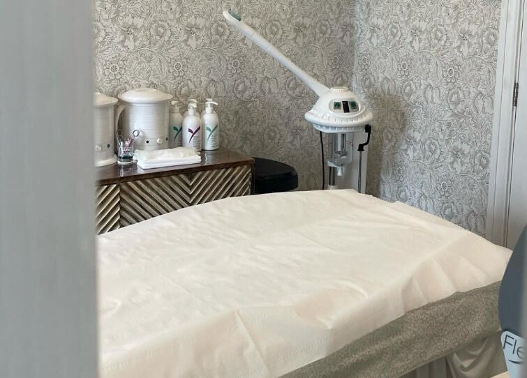 Serene treatment room at Cocoon Bristol featuring a cozy massage table - Bristol, England, GB.