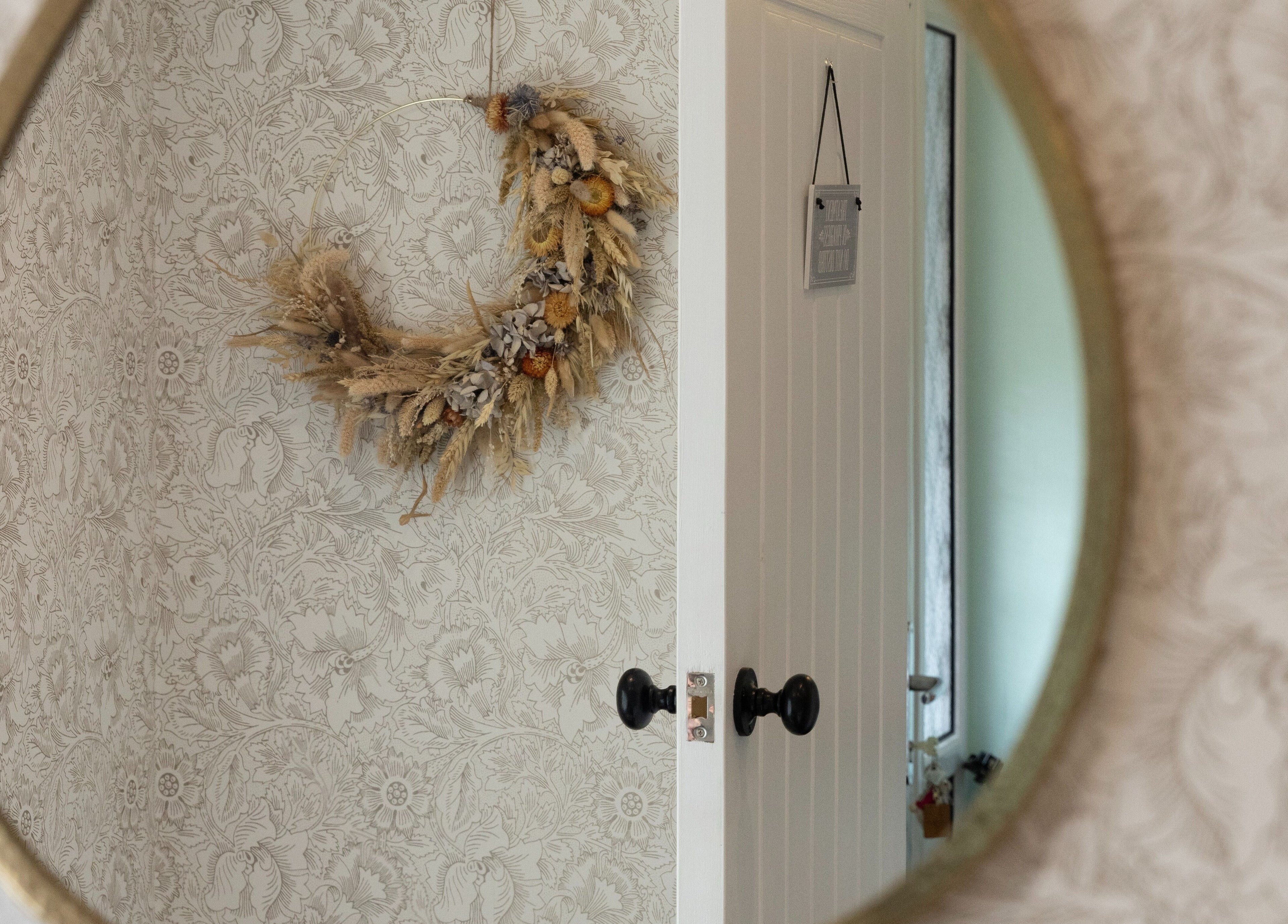 Elegant wall decor reflected in a mirror at Cocoon Bristol, Bristol, England, GB, showcasing sophisticated design.