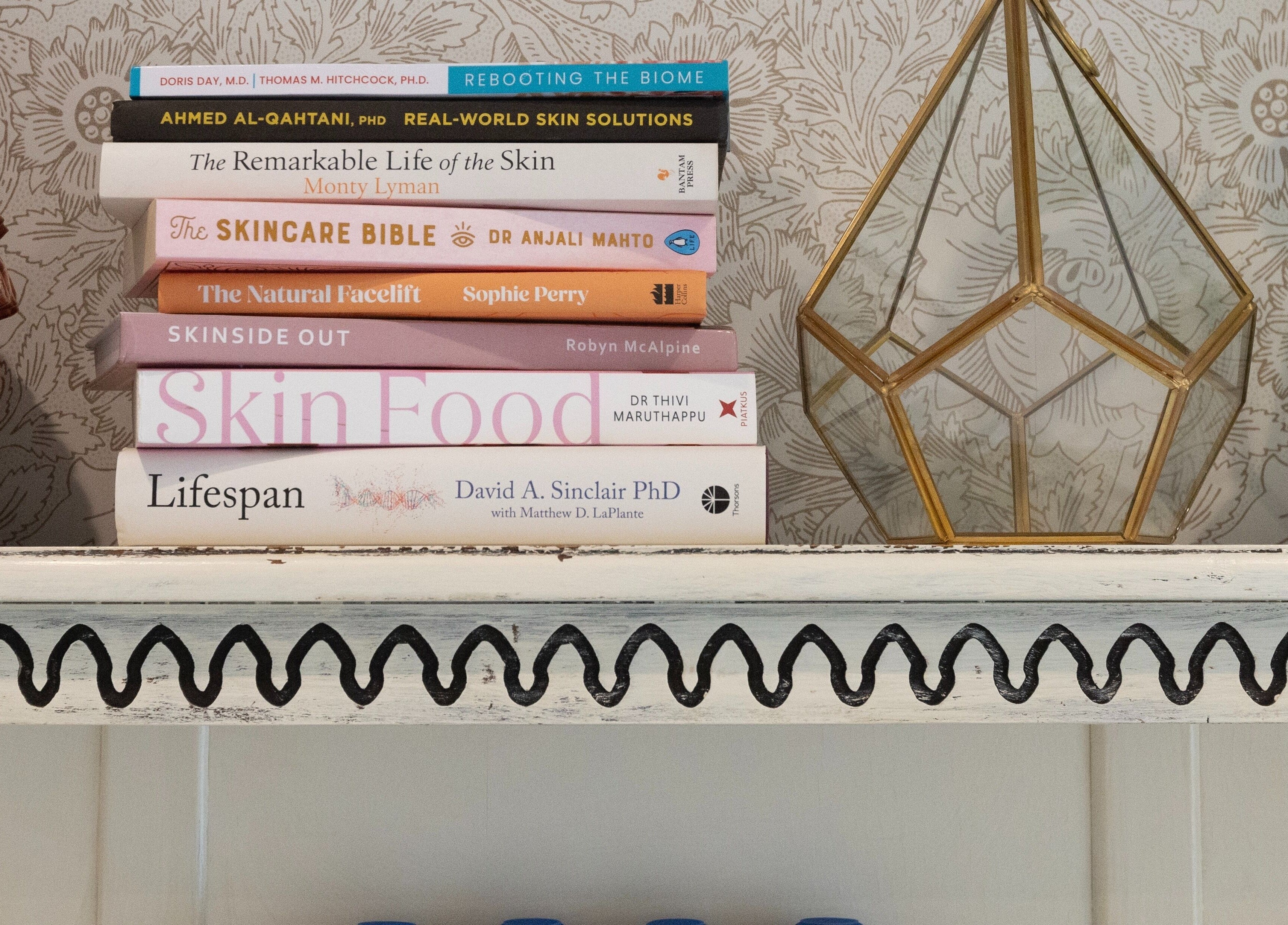 Stylishly curated shelf with beauty books at Cocoon Bristol, enhancing ambiance in Bristol, England, GB.