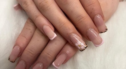 Stylish nail art at Sunkissed Tanning & Beauty in Ballymoney, Northern Ireland, GB featuring leopard and floral designs.