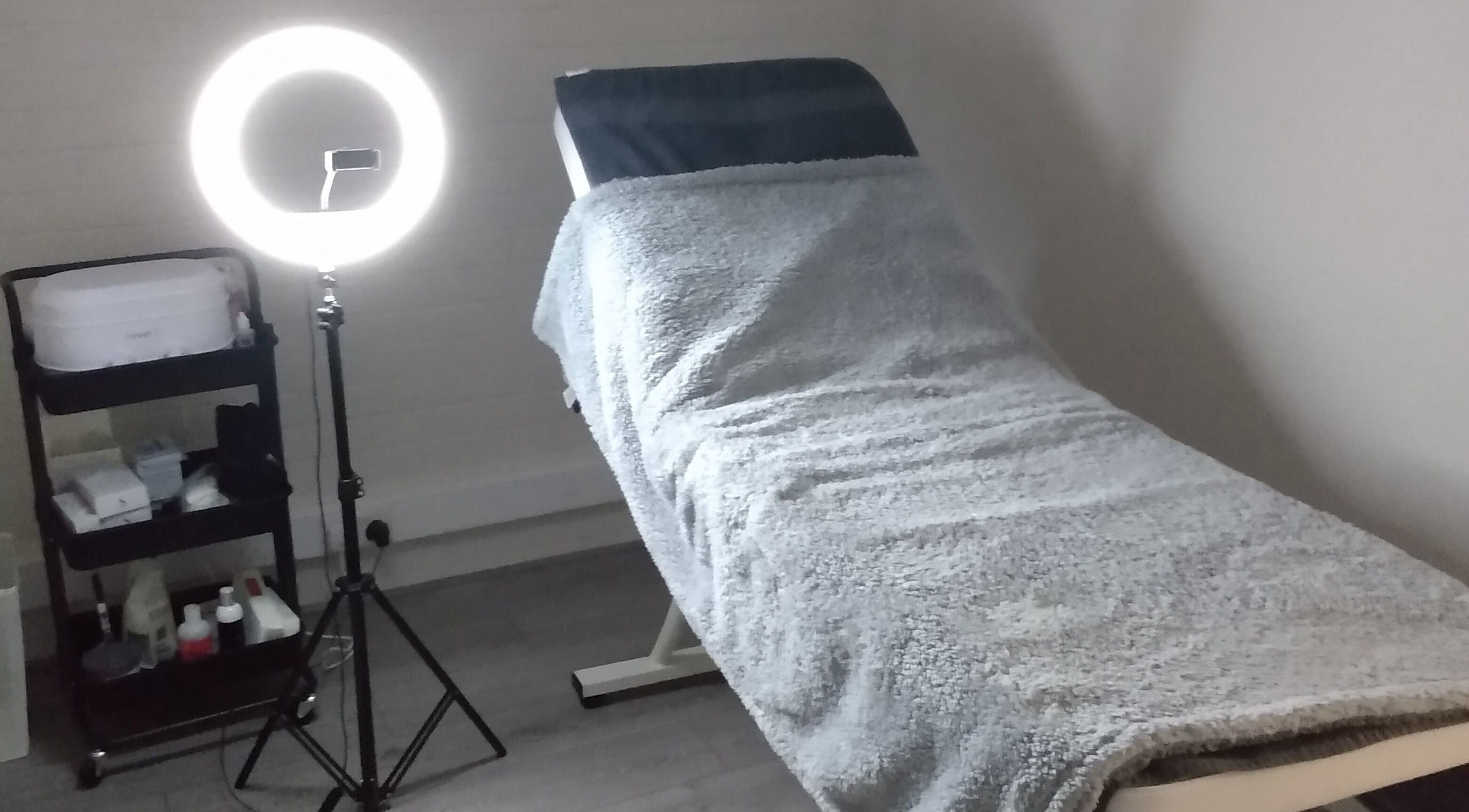 Tanning room at Sunkissed Tanning & Beauty in Ballymoney, Northern Ireland, GB, equipped with a modern ring light.